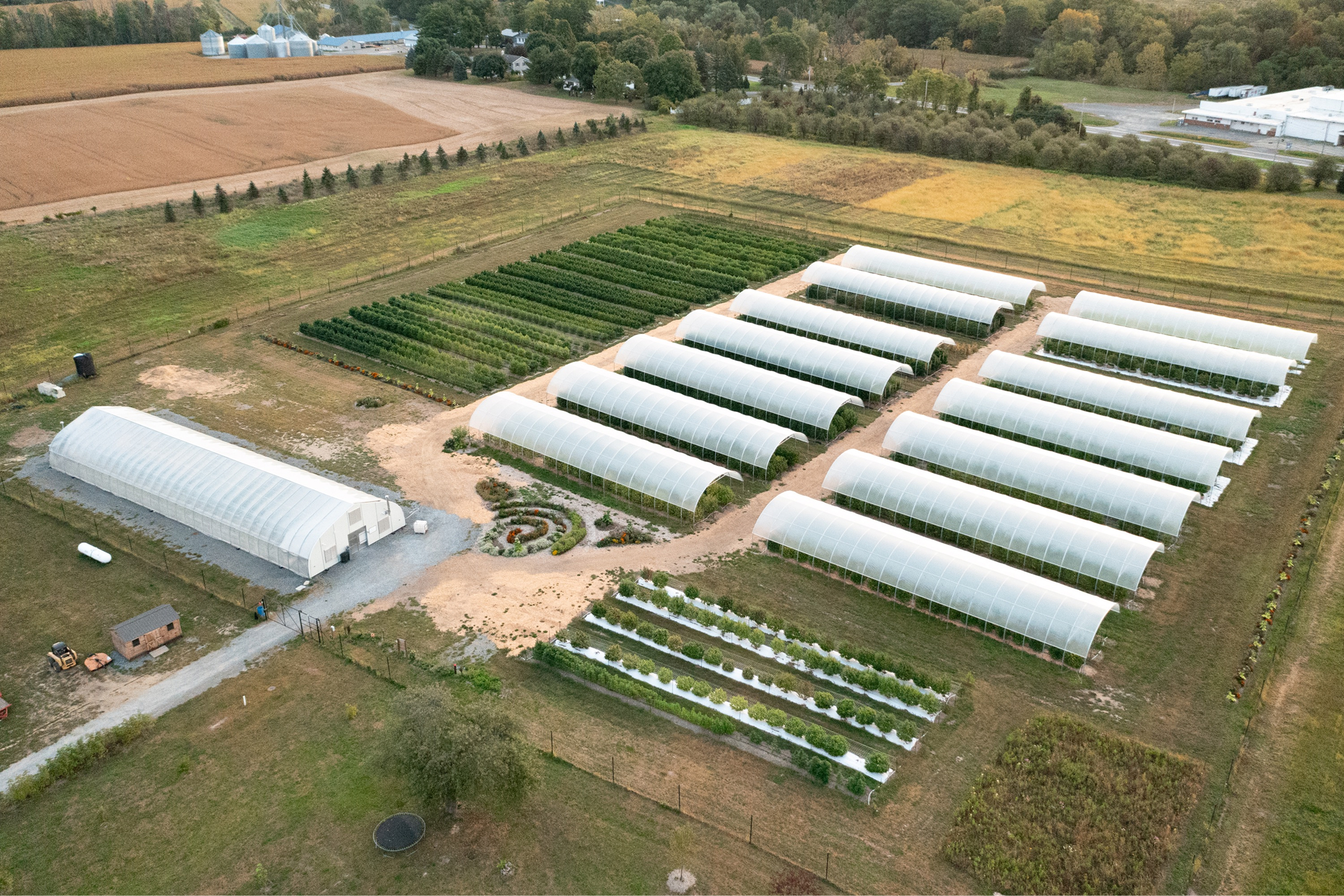 Farm aerial — greenhouses and outdoor rows, Hudson Valley