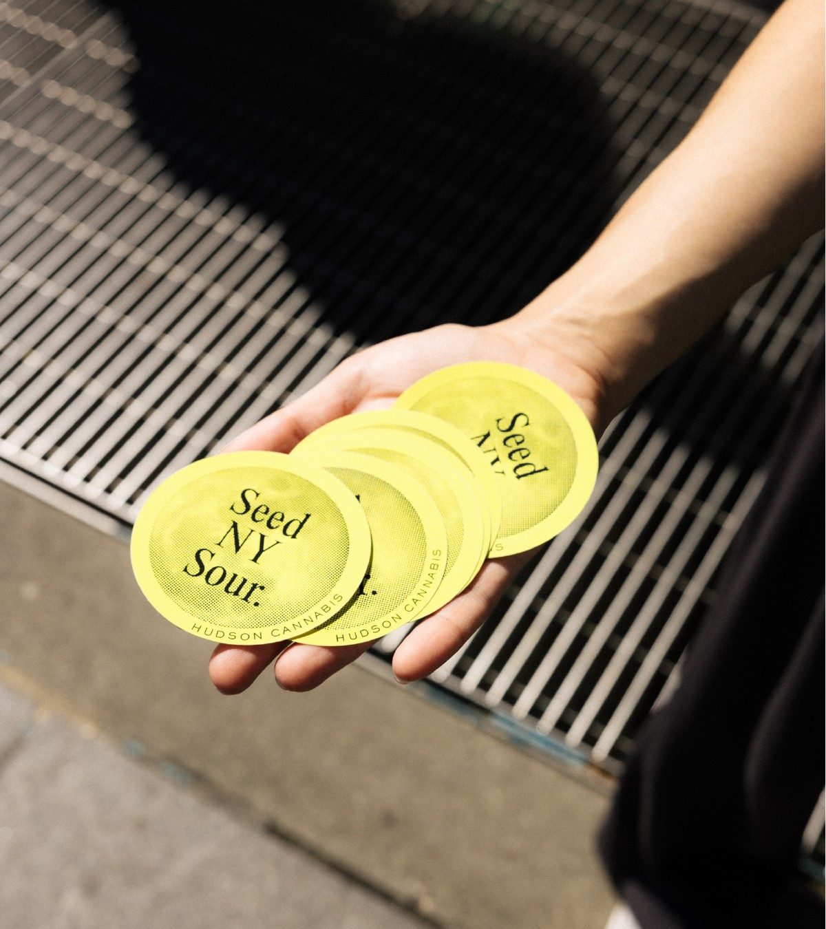 Seed NY Sour stickers, hand-held