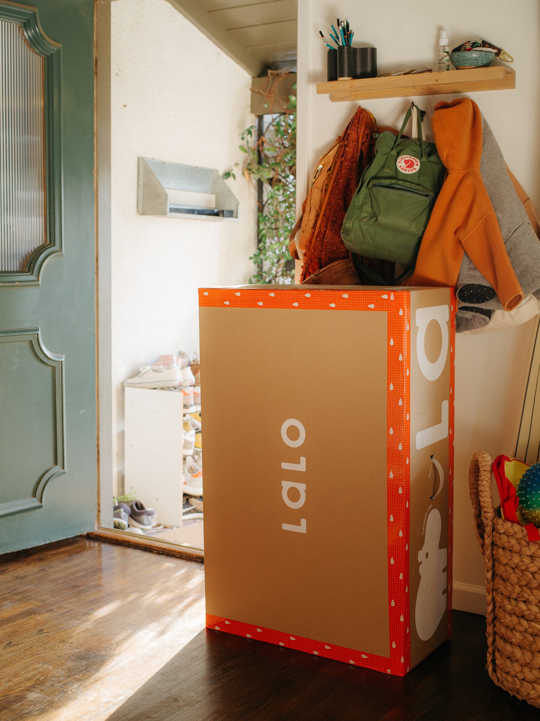 Packaging in use — shipping box in a family entryway
